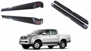 Vista principal de la pisadera trd para pick up toyota hilux vigo del 2006 al 2015 con una camioneta gris debajo